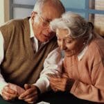 old couple playing cards