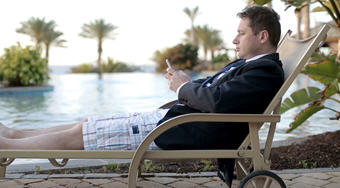 Look at this businessman. Oblivious to the beauty around him as he checks his email. So ridiculous - using all that data. Doesn’t he know the hotel has WiFi?