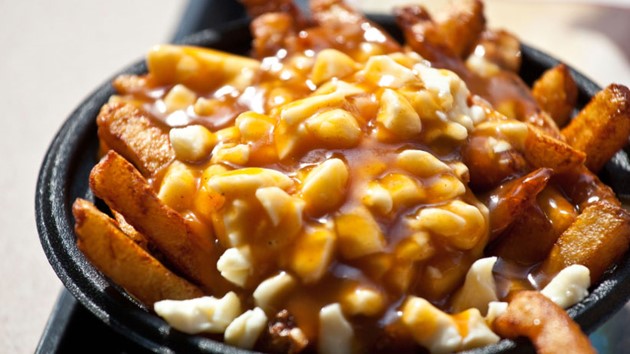 Poutine – a French Canadian dinner staple consisting of French fries, cheese curds and beef gravy that has become Canada’s signature meal – or as I call it, The Artery Assassin.