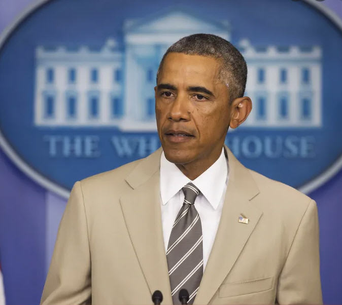Obama should have been impeached for this fashion faux pas alone. A beige suit in the White House? Seriously? And his boring tie didn’t even go all the way down to his crotch like my ties do. Truly criminal.